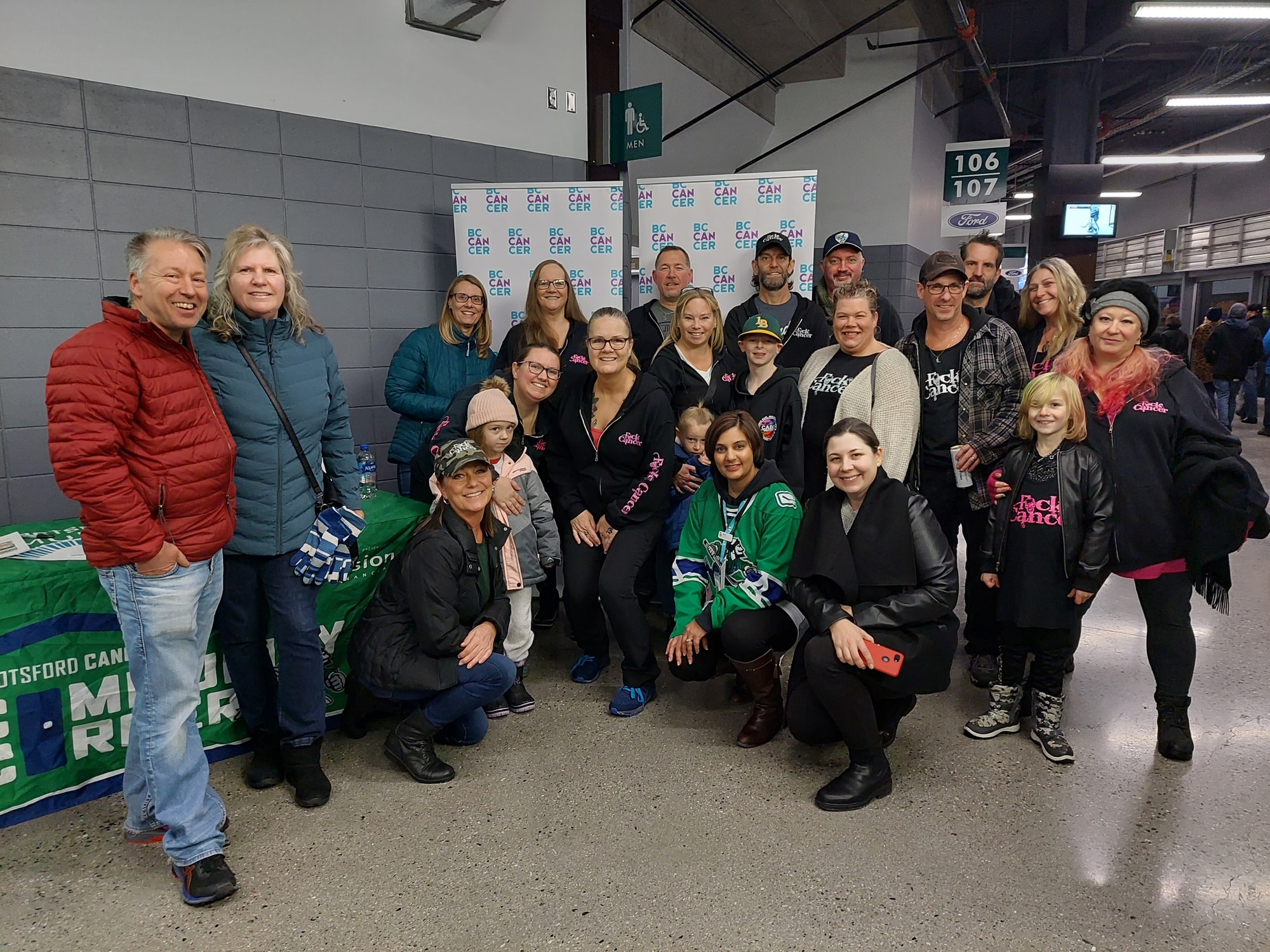 Large group posed together at an event venue